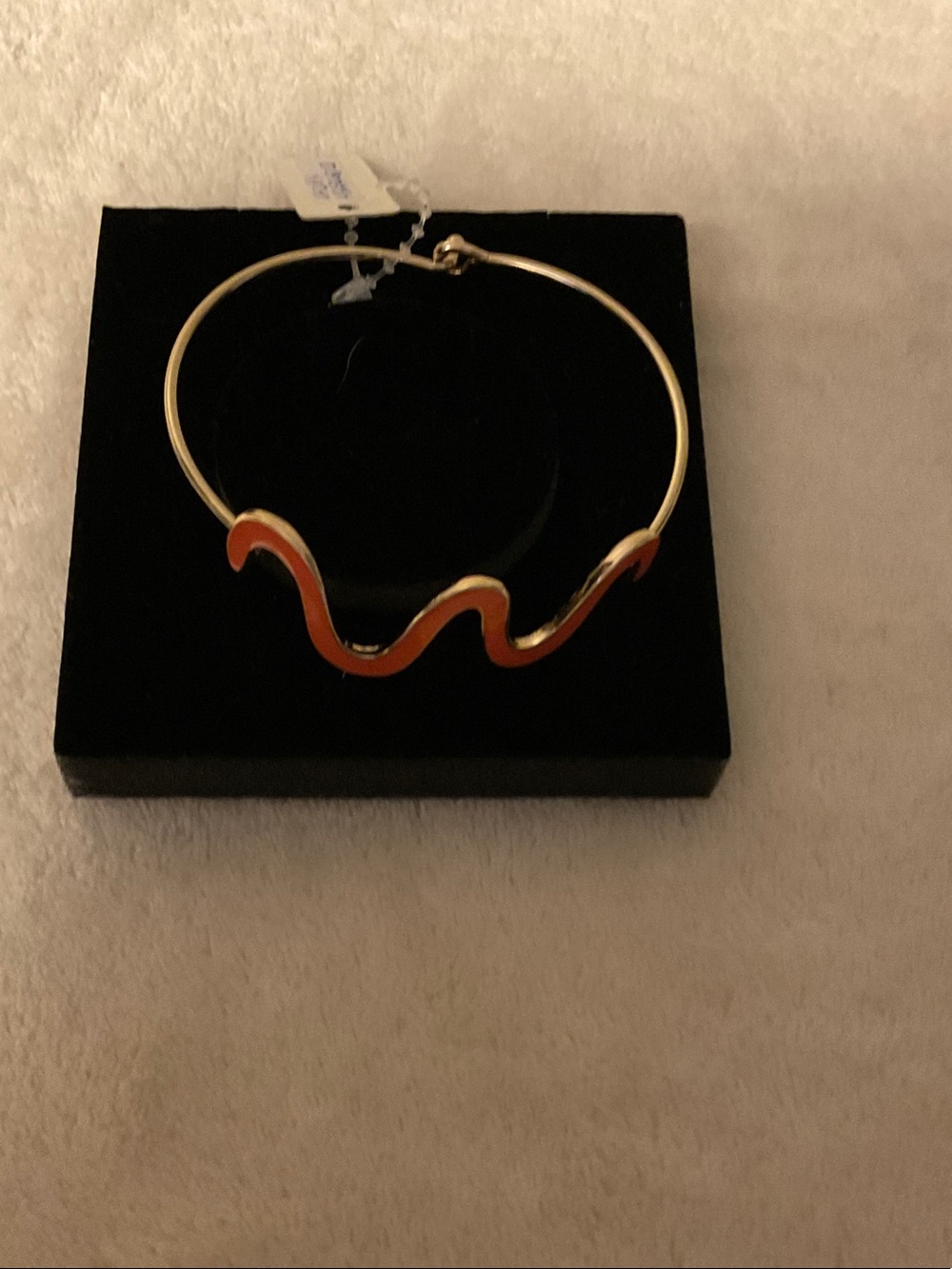 Gold-Tone Wave Bangle Bracelet with Orange Enamel Accent